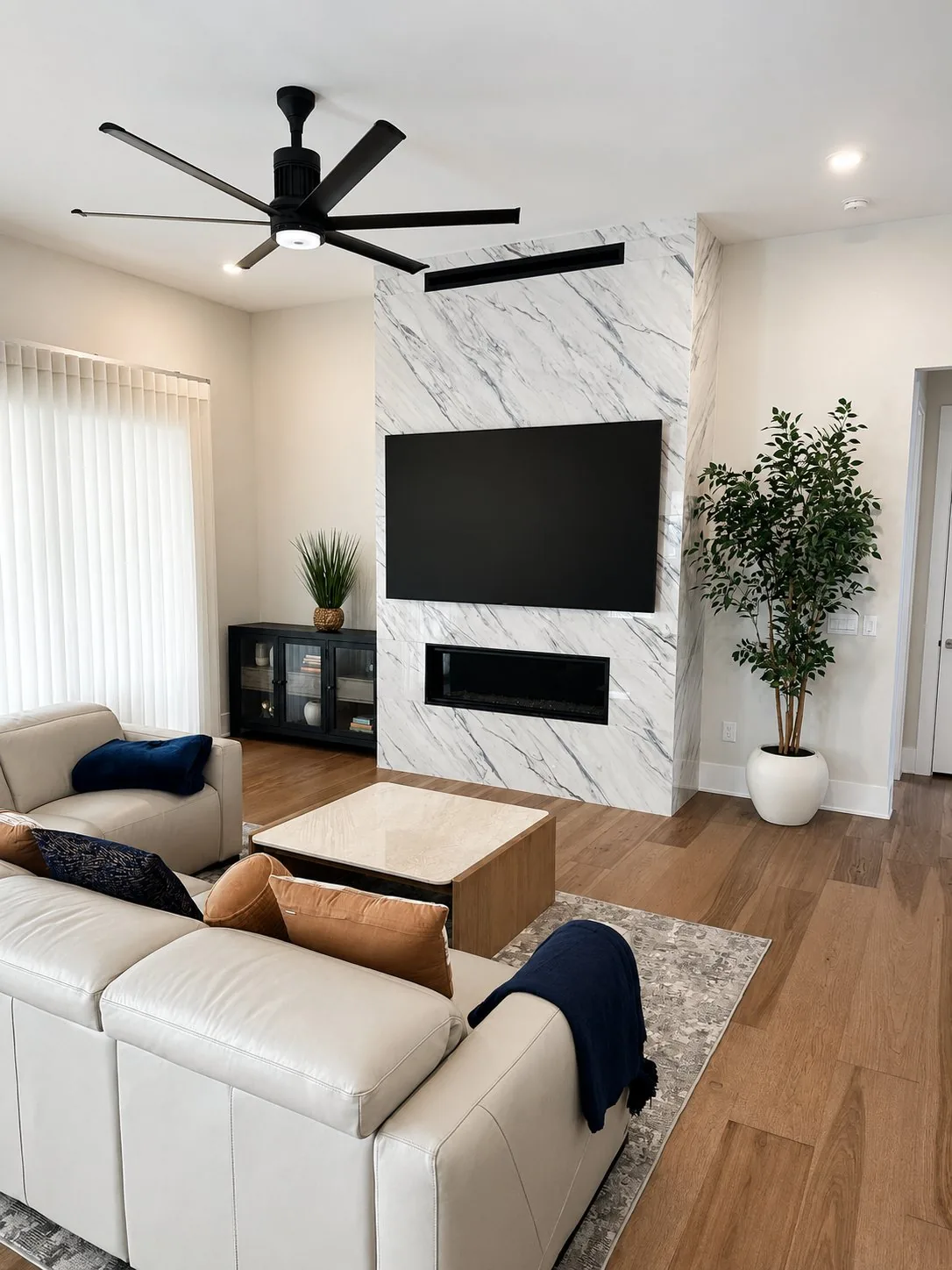 85 inch LG OLED full-motion mount white quartz fireplace Cary NC